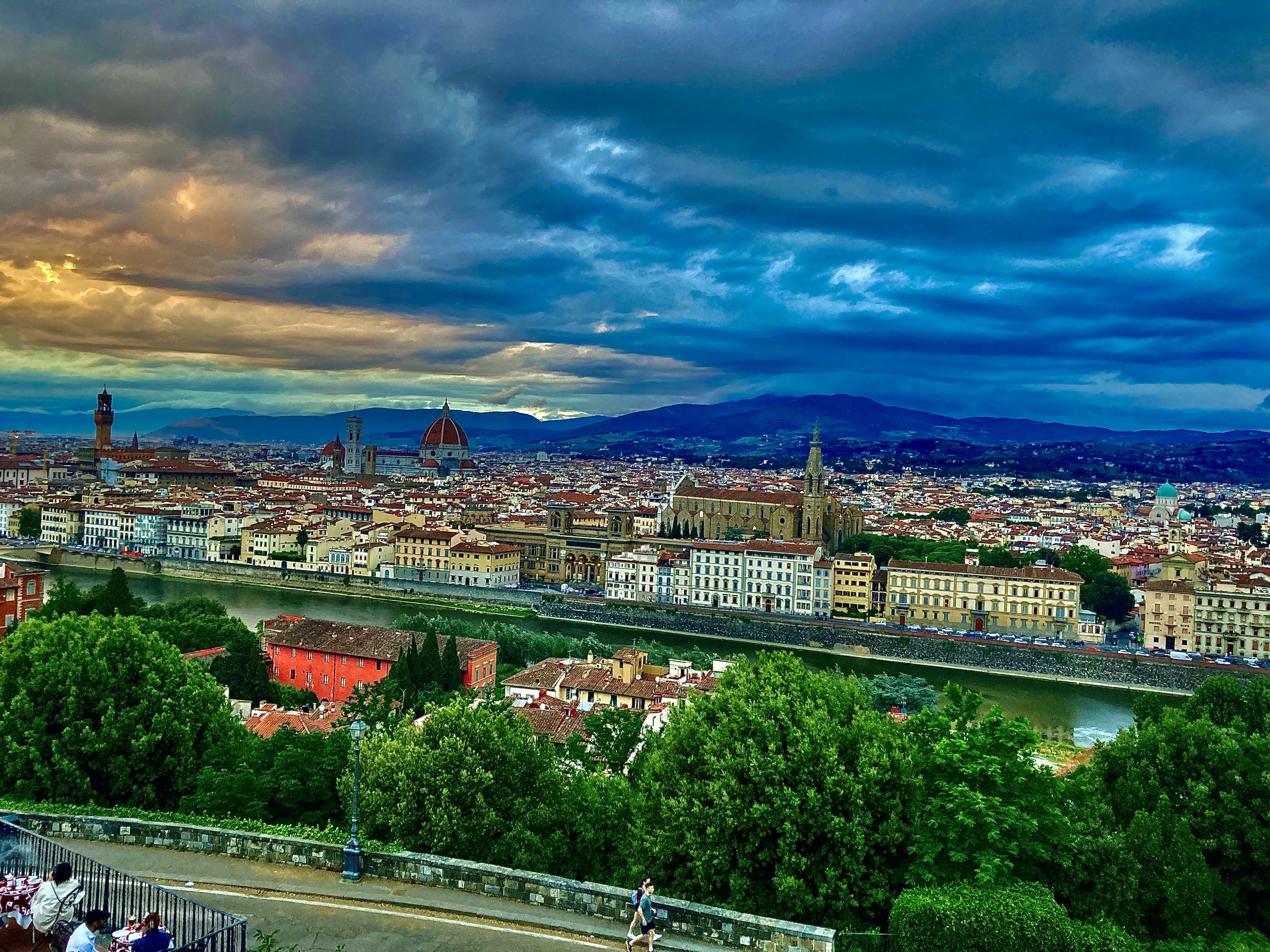 A view of a sunset over Florence, Italy from a high lookout.